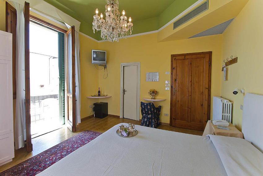 Postel nebo postele na pokoji v ubytování Hotel Maestoso