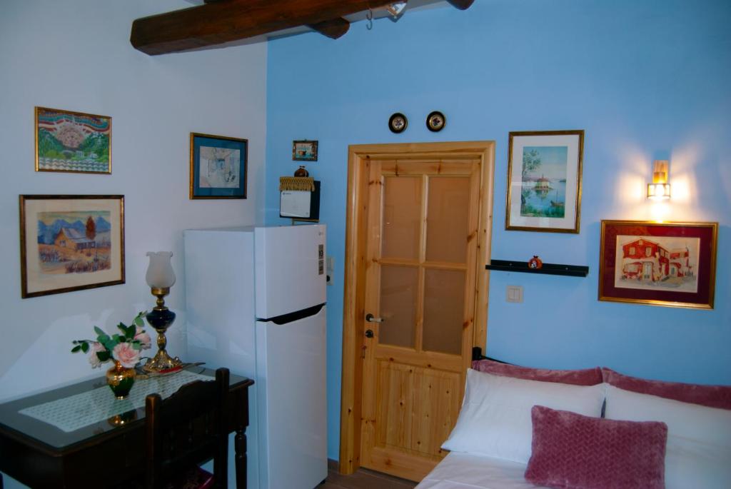 A bed or beds in a room at Yangos traditional home