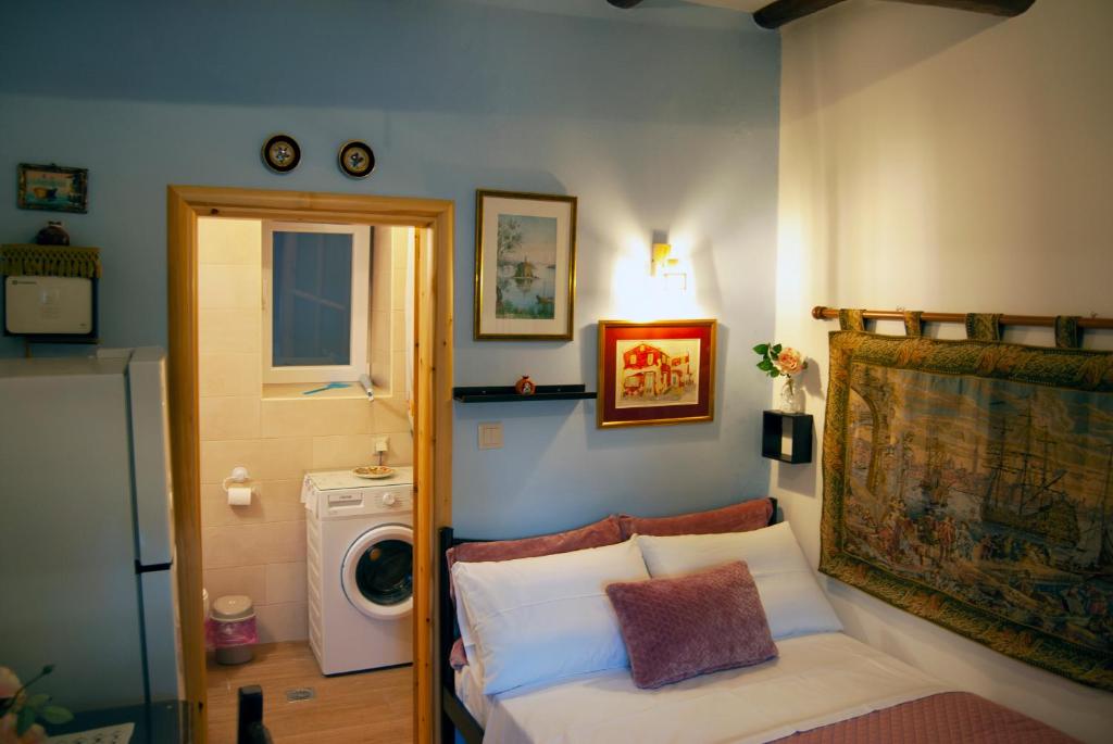 A bed or beds in a room at Yangos traditional home