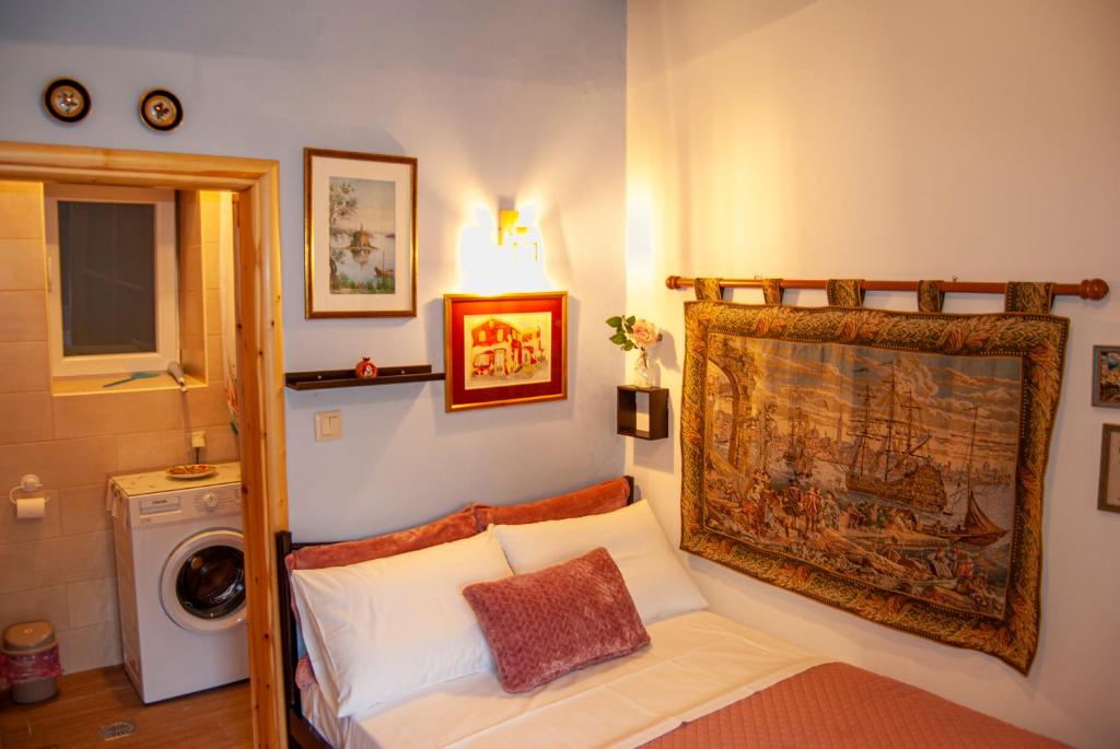 A bed or beds in a room at Yangos traditional home