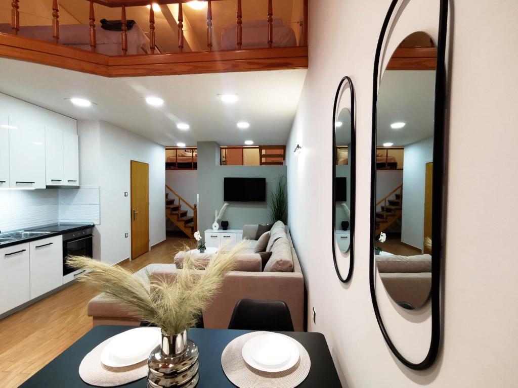 a living room with a couch and a table at PG Luxury Apartment in Kavála