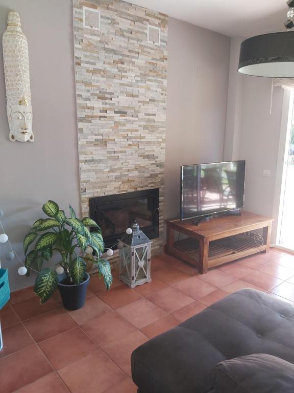 Televízia a/alebo spoločenská miestnosť v ubytovaní VILLA DEL MAR