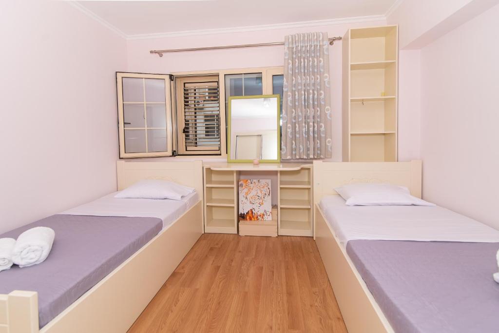 Postel nebo postele na pokoji v ubytování Tirana Central Exclusive