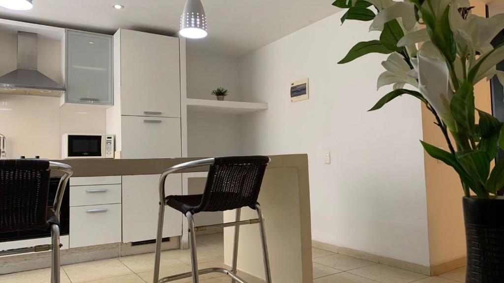 A cozinha ou kitchenette de Vallclaire Suites