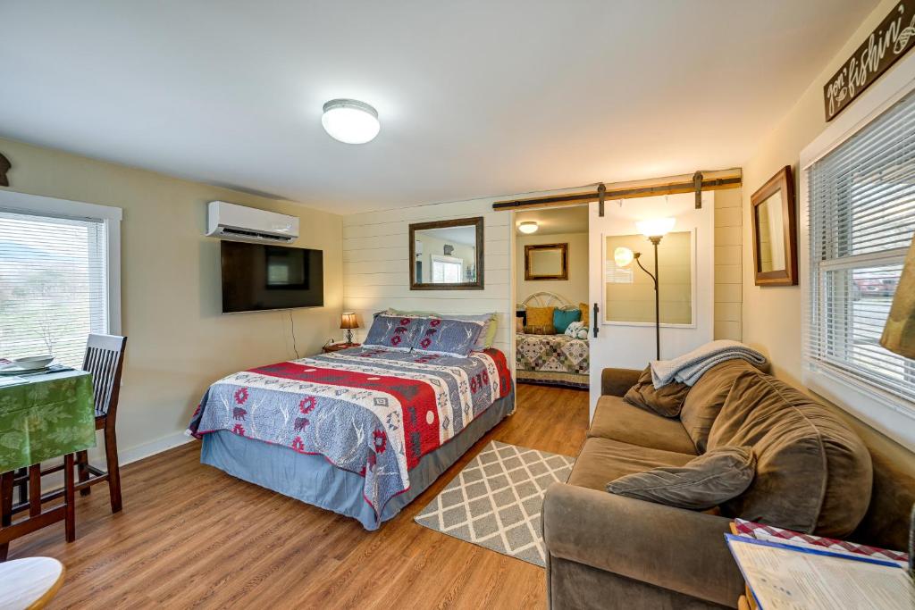 a bedroom with a bed and a couch at Pet-Friendly Vacation Rental Cabin in Whittier in Whittier