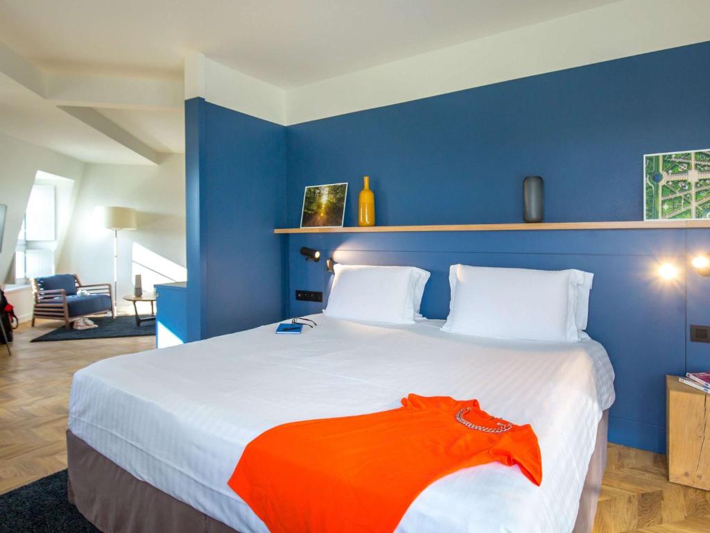 Postel nebo postele na pokoji v ubytování Mercure Chantilly Resort & Conventions