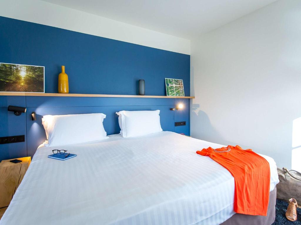 Postel nebo postele na pokoji v ubytování Mercure Chantilly Resort & Conventions