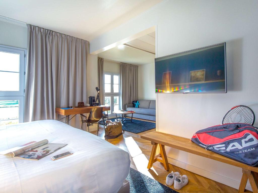 Postel nebo postele na pokoji v ubytování Mercure Chantilly Resort & Conventions