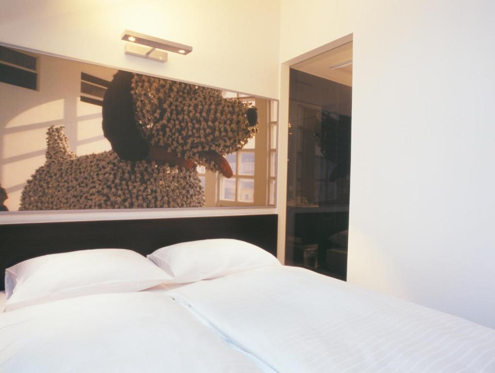 Postel nebo postele na pokoji v ubytování arte Hotel Linz