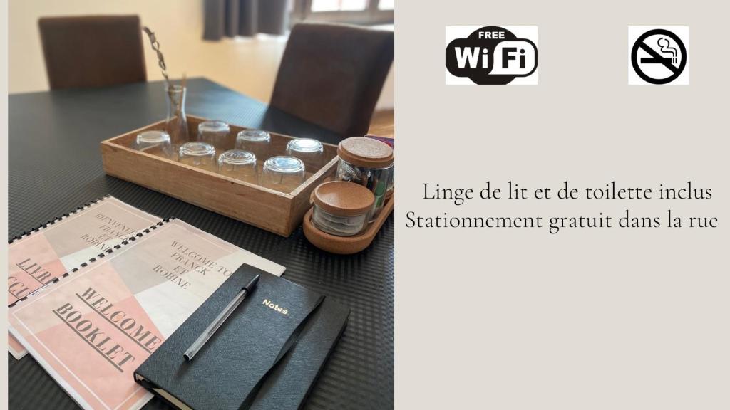 a table with a wallet and a box of coins at Superbe appartement F4 au cœur de Malo-les-bains in Dunkerque