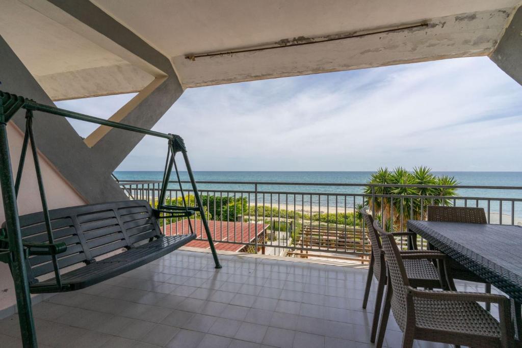 a balcony with a view of the ocean at SEAFRONT SUITE 5 Stars - Comfortable Apartment in Marina di Strongoli