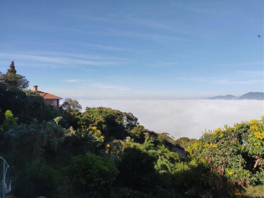 a house on top of a hill overlooking the ocean at La Casita de Chocolate 3 in Bogotá