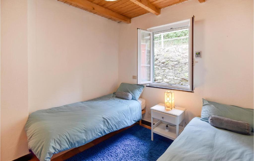 A bed or beds in a room at 3 Bedroom Gorgeous Home In Uscio