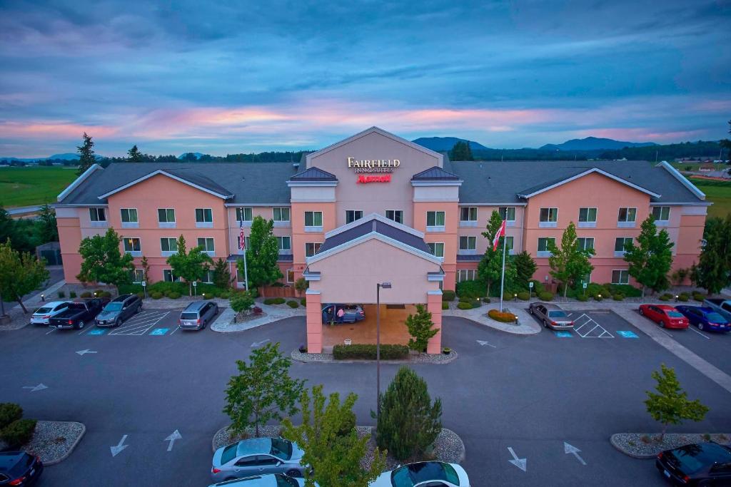 an aerial view of a hotel with a parking lot at Fairfield Inn & Suites Burlington in Burlington