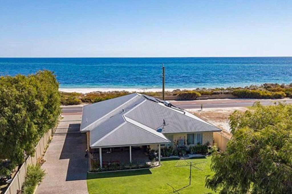 an aerial view of a house next to the ocean at The Dunes Pet Friendly Beachfront Family Retreat Busselton in Busselton