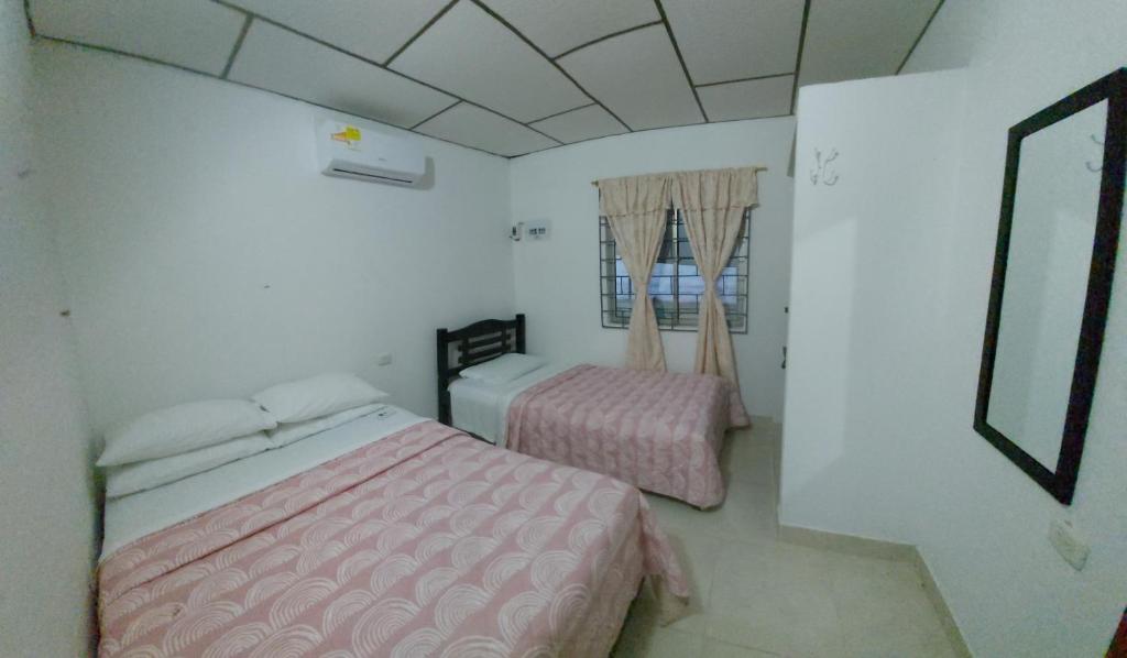 Postel nebo postele na pokoji v ubytování Guio Apartamentos
