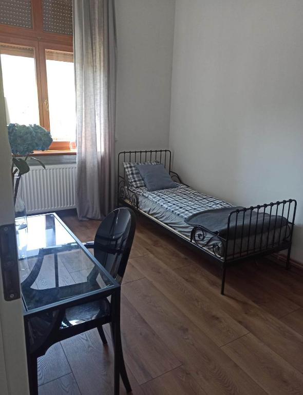 Postel nebo postele na pokoji v ubytování Apartament Stara Tkalnia