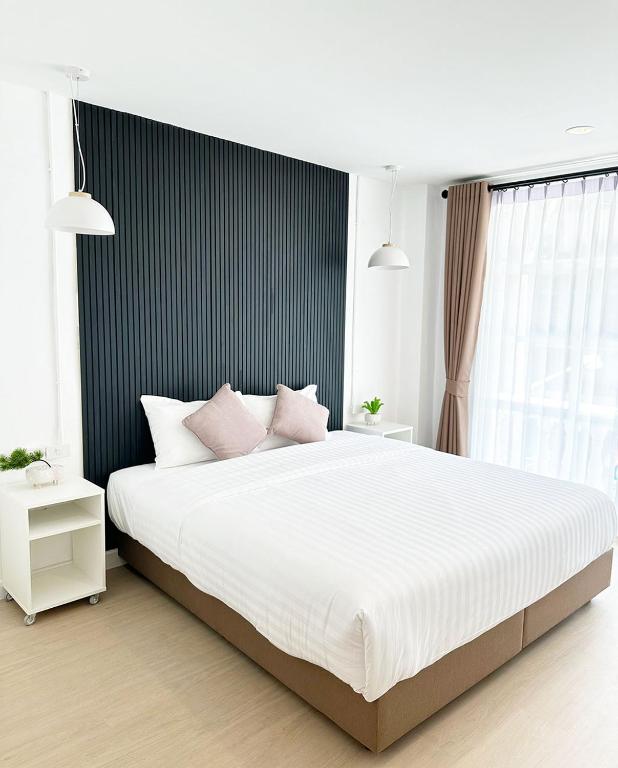 Postel nebo postele na pokoji v ubytování River Home Bangkok