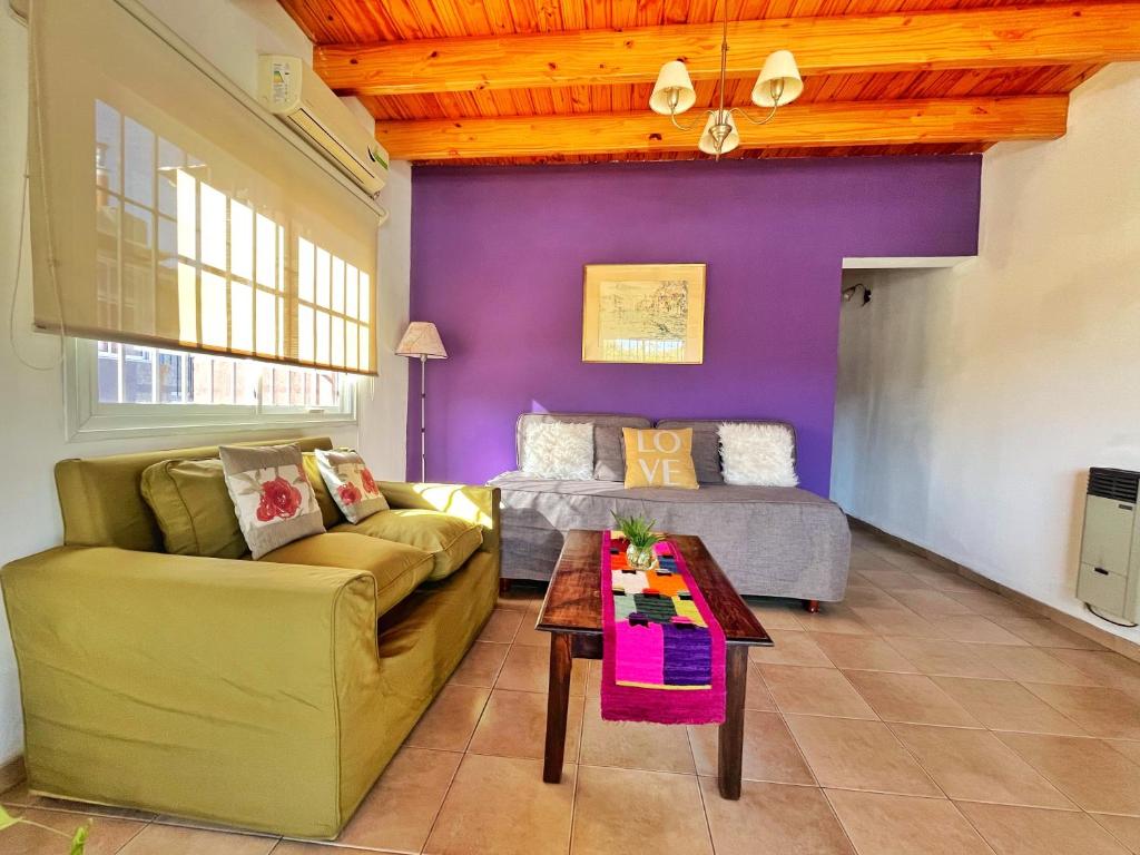 a living room with a couch and a table at Dpto Ayacucho in Mendoza