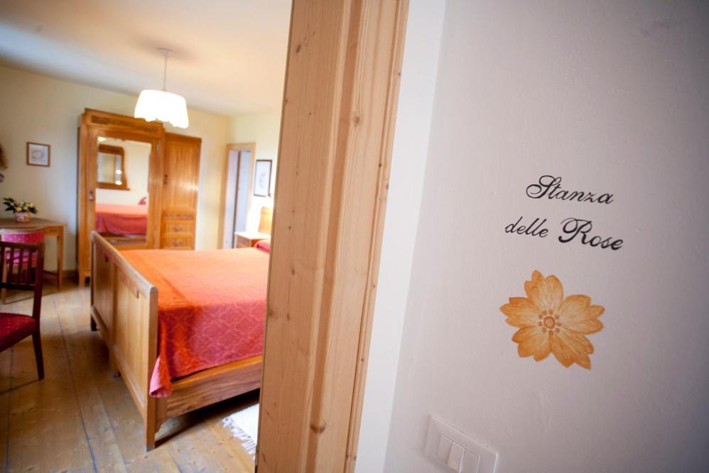 Postel nebo postele na pokoji v ubytování Agriturismo Casa Rossa Ai Colli