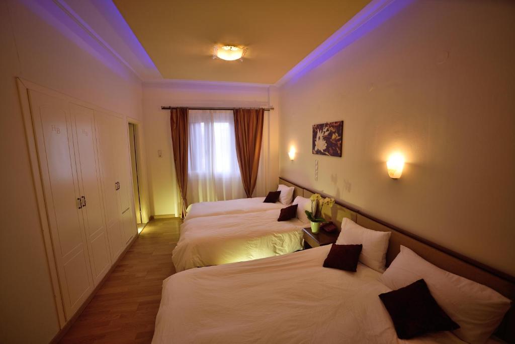 Postel nebo postele na pokoji v ubytování Byzantion Hotel