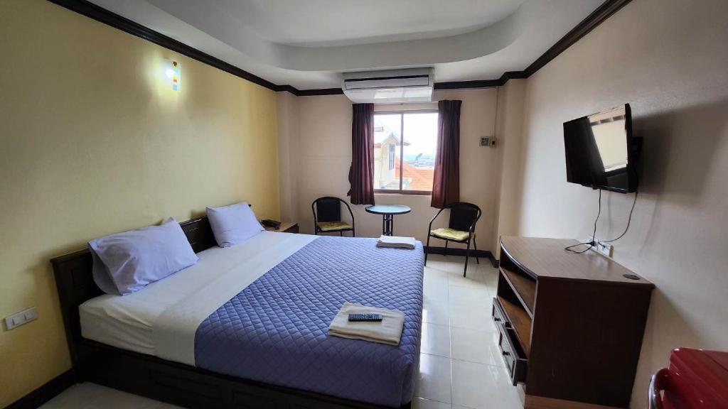 Postel nebo postele na pokoji v ubytování White Rose​ Hotel​ II​