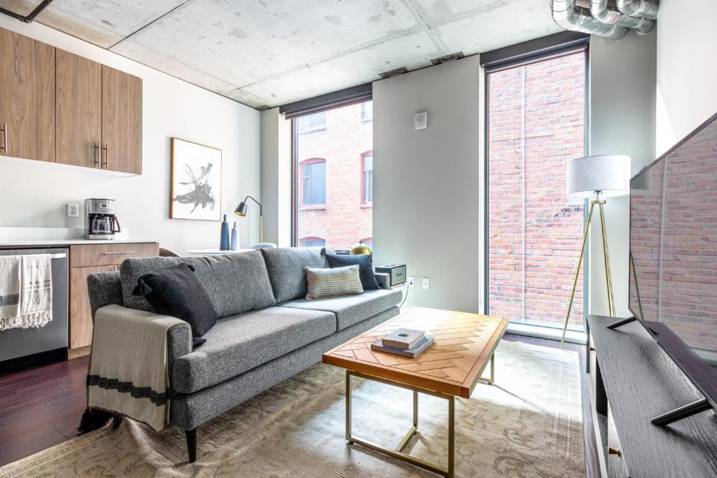 a living room with a couch and a table at Downtown Studio w Gym WD walkable location SEA-47 in Seattle