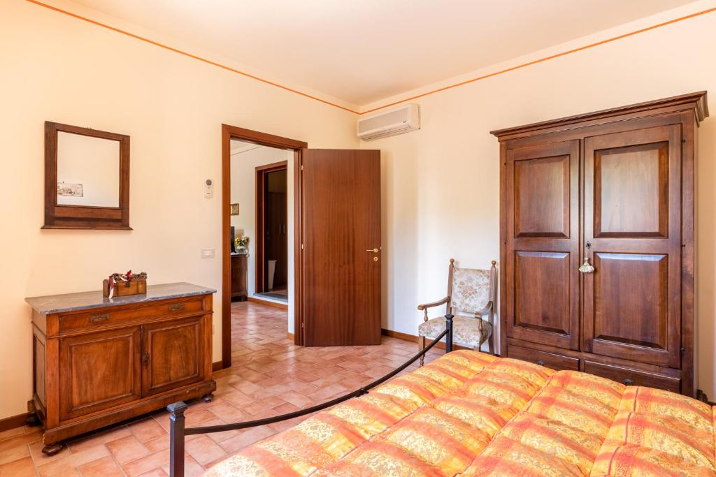 Postel nebo postele na pokoji v ubytování Casolare dei Fiori - Mughetto