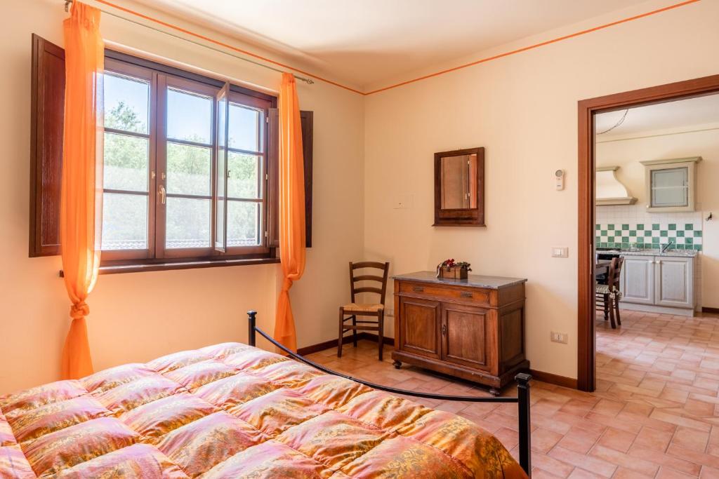 Postel nebo postele na pokoji v ubytování Casolare dei Fiori - Mughetto