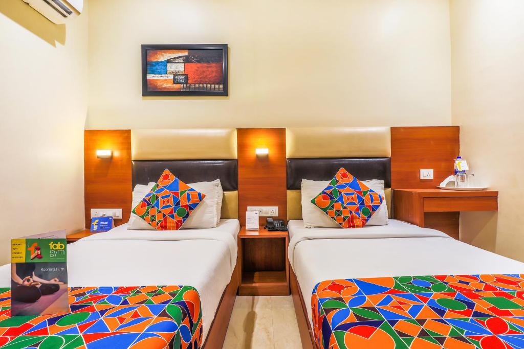 Postel nebo postele na pokoji v ubytování FabHotel Liwa International - Nr Mumbai International Airport