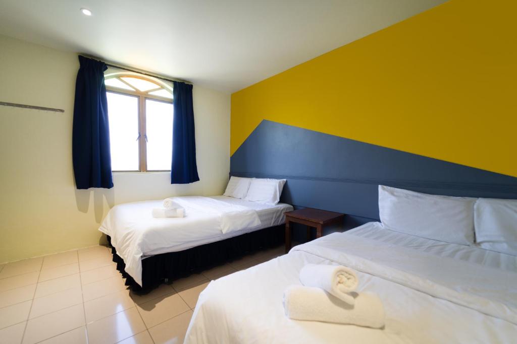 Postel nebo postele na pokoji v ubytování The Colony by Cactus Hotel Dedap