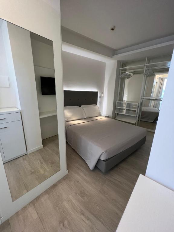 Postel nebo postele na pokoji v ubytování Hotel Ardea