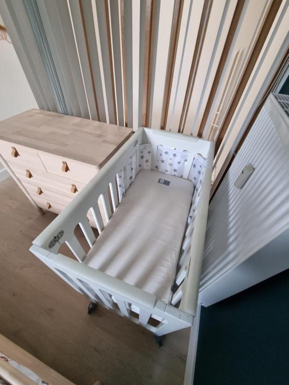 Postel nebo postele na pokoji v ubytování Gîte La Petite Ourse - gîte de charme citadin