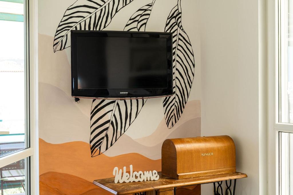 Televízia a/alebo spoločenská miestnosť v ubytovaní Apartment Radovan