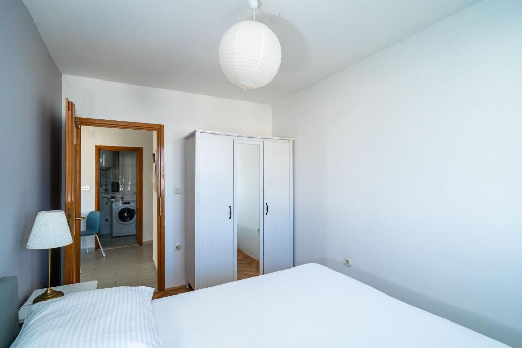 Posteľ alebo postele v izbe v ubytovaní Apartment Radovan