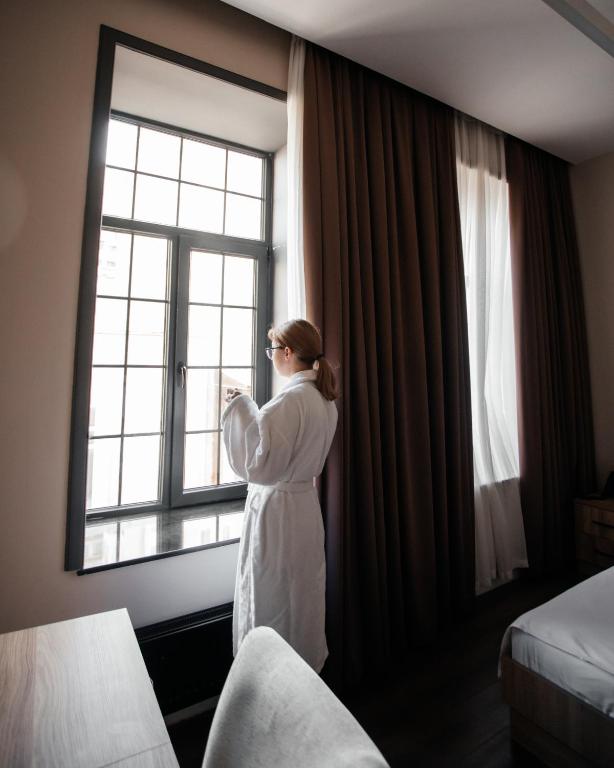 Postel nebo postele na pokoji v ubytování OLF Hotel