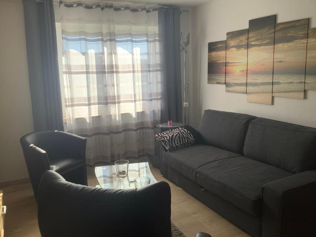 Posezení v ubytování Ferienwohnung Zur Sperrmauer