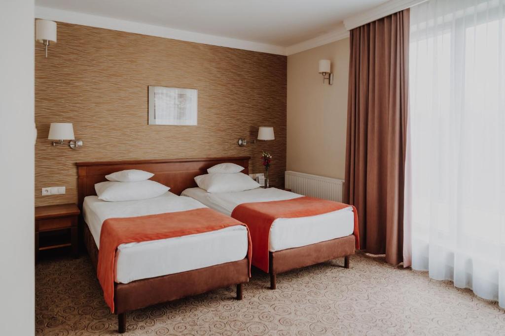 Postel nebo postele na pokoji v ubytování Hotel Esperanto