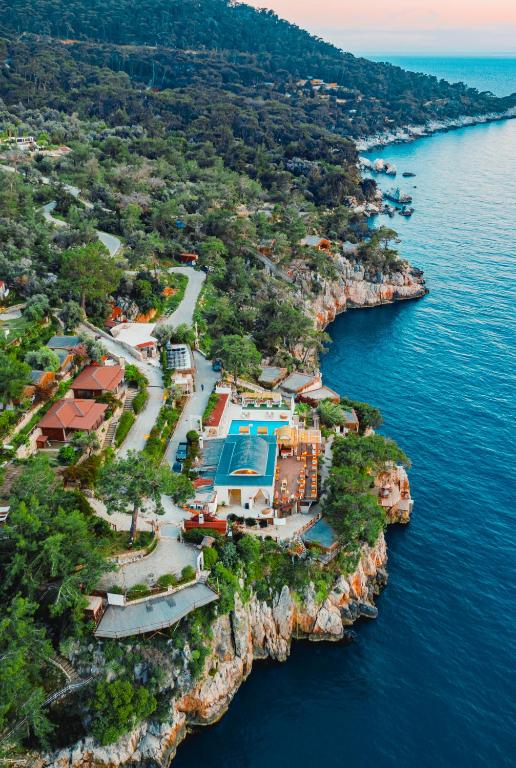 an aerial view of an island in the water at Zakros Hotel Lykia in Faralya