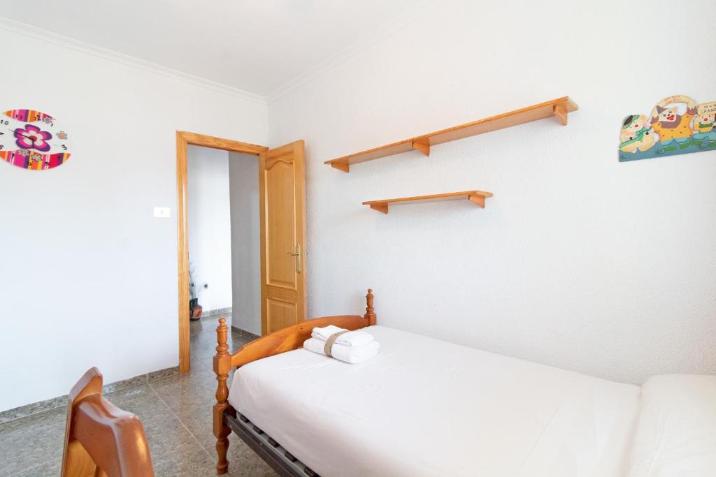 Postel nebo postele na pokoji v ubytování Global Properties, Apartamento con terraza y piscina a un paso de la playa