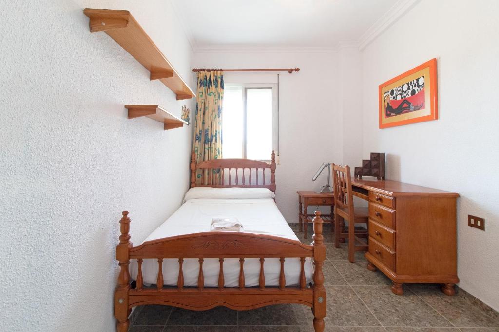 Postel nebo postele na pokoji v ubytování Global Properties, Apartamento con terraza y piscina a un paso de la playa