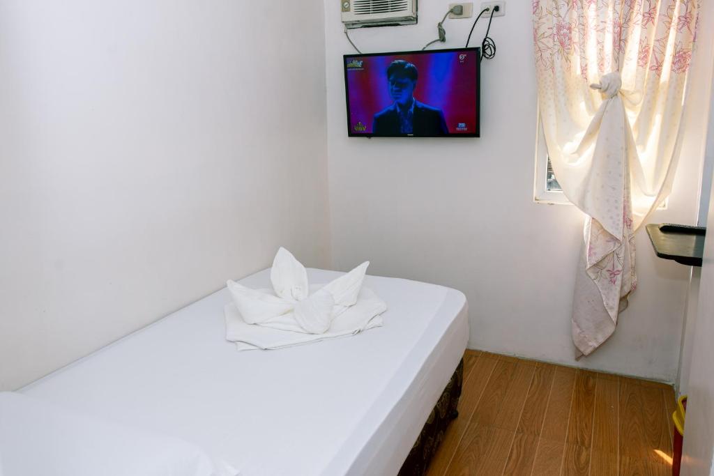 Postel nebo postele na pokoji v ubytování FB Budgetel Suites