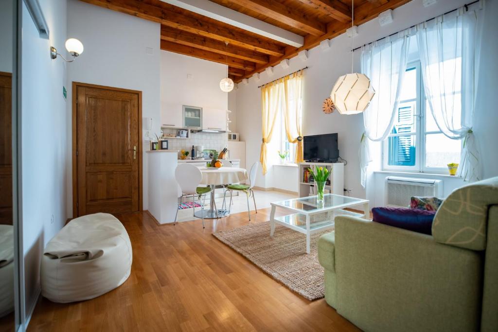 a living room with a couch and a table at Apartment Ivo in Dubrovnik
