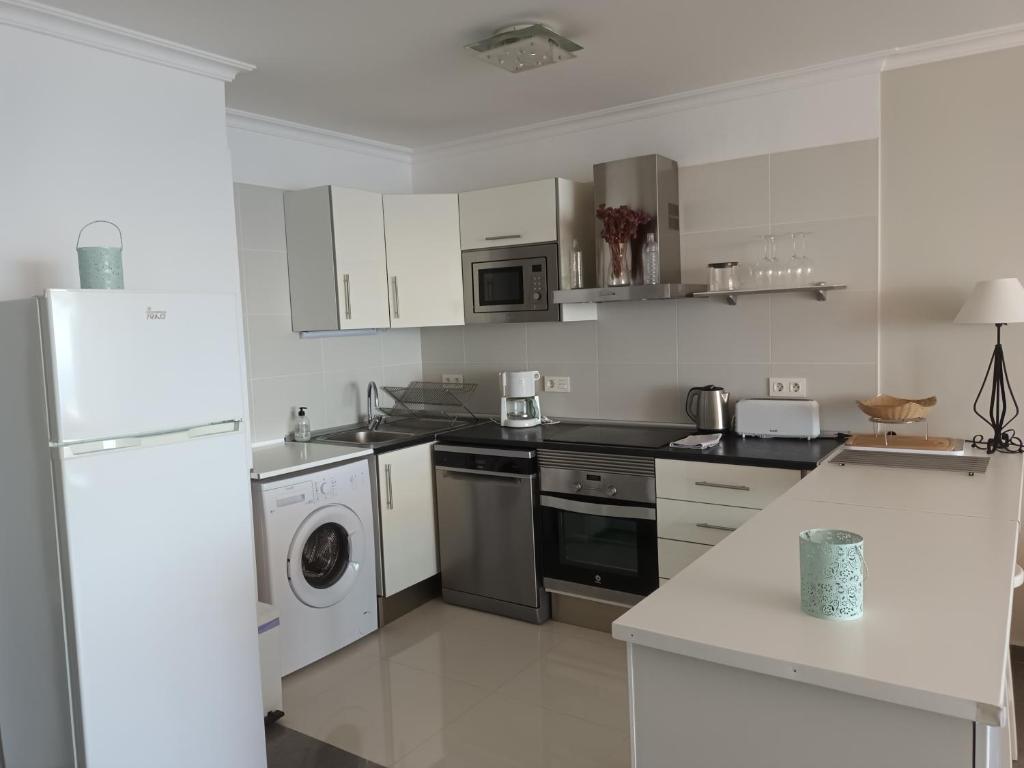 A kitchen or kitchenette at Great oportunity Costa Adeje Holiday apartment first sea line Free Wifi
