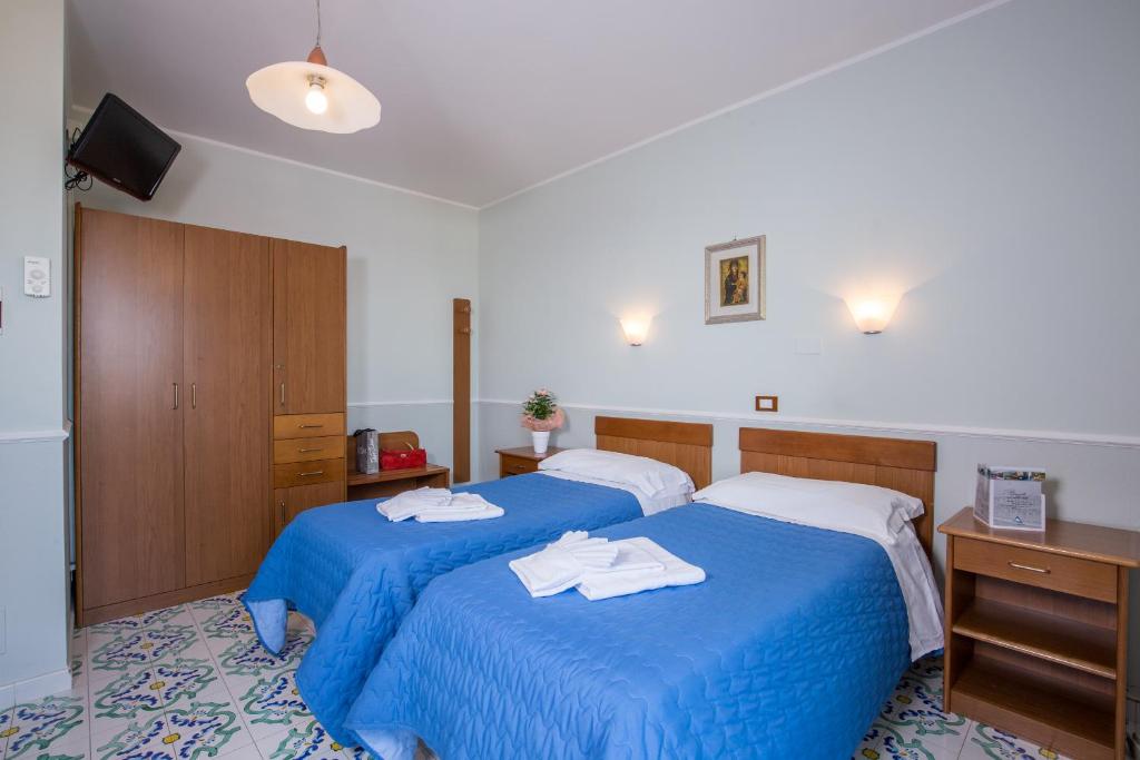 Postel nebo postele na pokoji v ubytování Hotel Casa Tra Noi