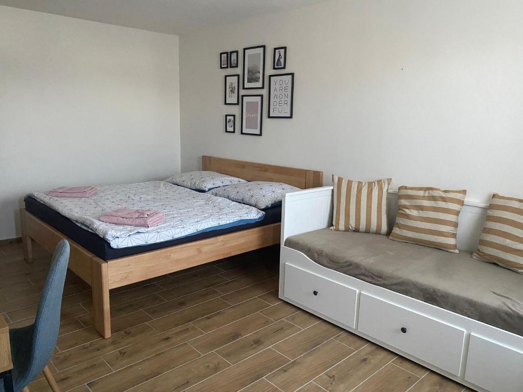A bed or beds in a room at R-Penzion