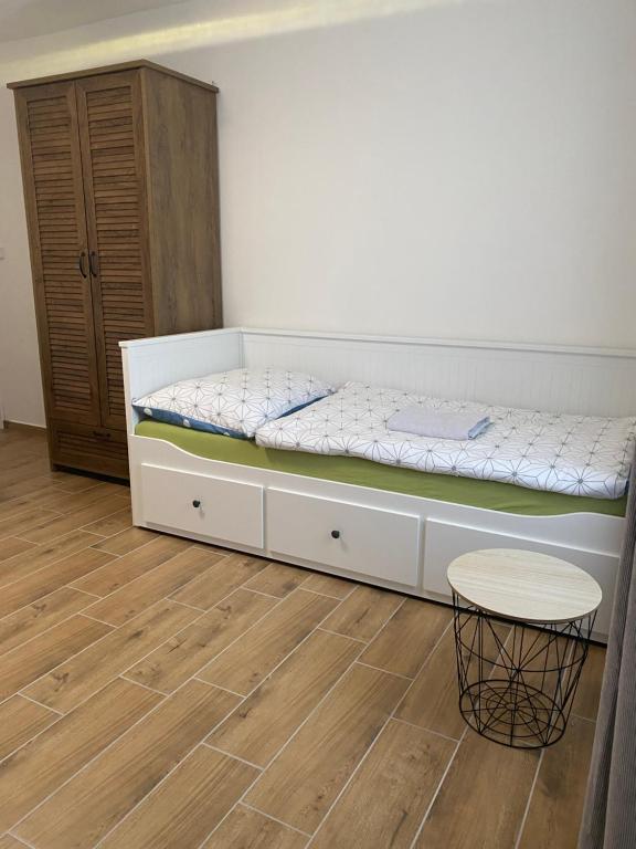 A bed or beds in a room at R-Penzion