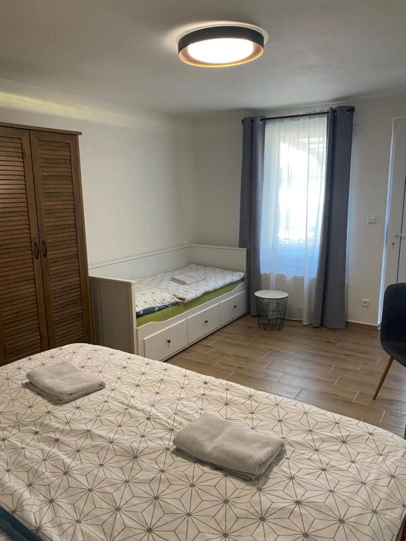 A bed or beds in a room at R-Penzion
