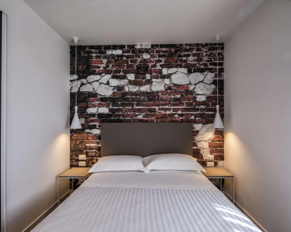 Postel nebo postele na pokoji v ubytování Best Western Hotel Corsi