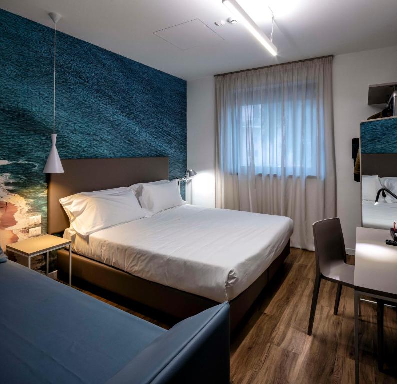 Postel nebo postele na pokoji v ubytování Best Western Hotel Corsi
